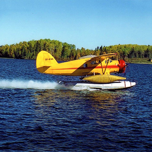 Float plane landing on lake
